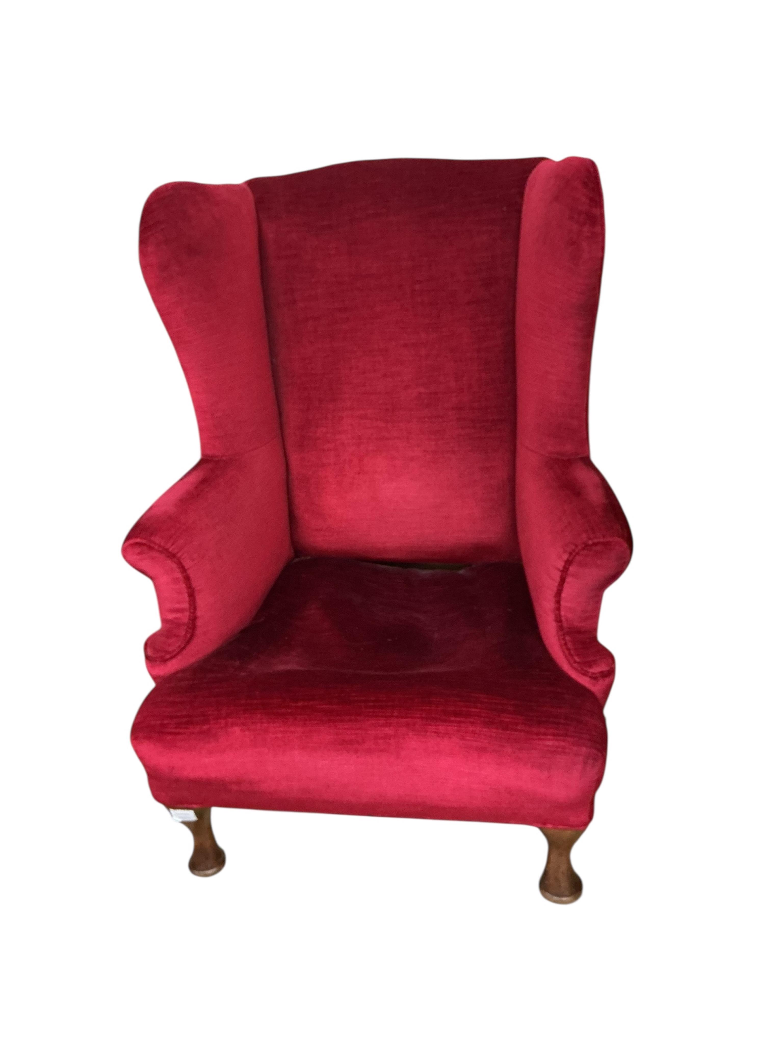 An early 20th century Queen Anne style upholstered wing armchair, width 83cm, depth 86cm, height 90cm